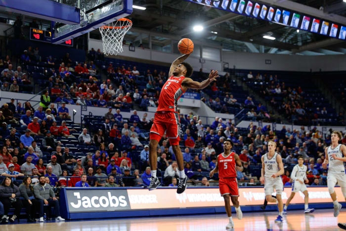 Jan 20, 2024; Colorado Springs, Colorado, USA; New Mexico Lobos guard Donovan Dent (2) dunks the ball in the second half against the Air Force Falcons at Clune Arena.
